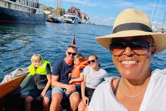 Private Copenhagen Boat cruise in Scandinavian mahogany boat - Christianshavns Kanal: Houseboats, Restaurants, and the Spire-View Finish